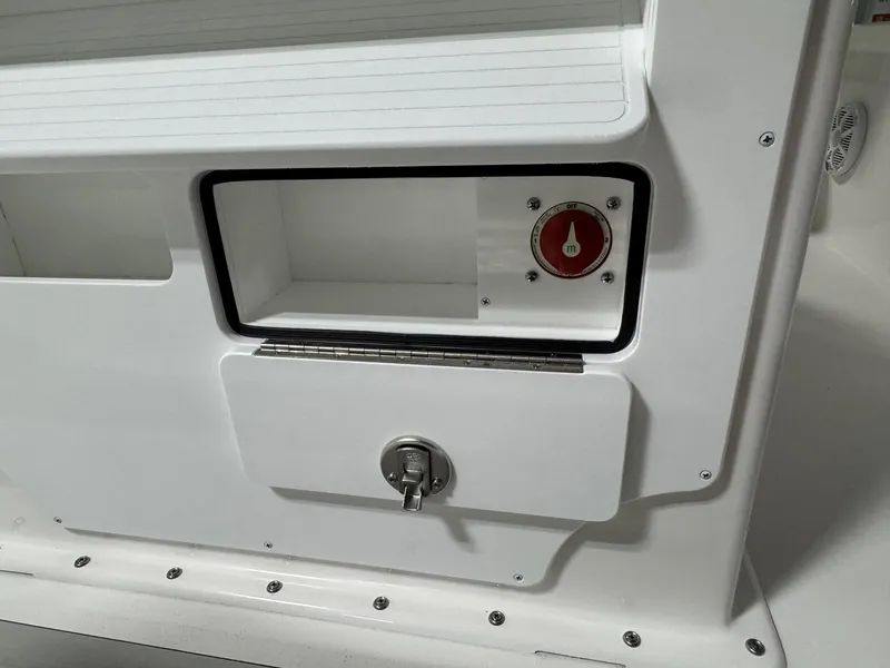 Slide: The Image of 2026 Bay Rider 2260 FS Skiff interior detail with storage compartment and control panel. - 20
