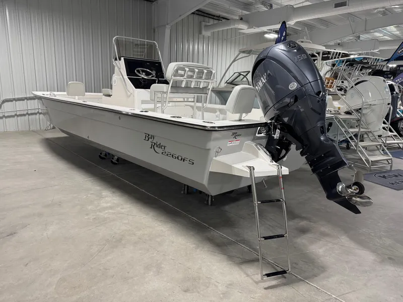 Slide: The Image of 2026 Bay Rider 2260 FS Skiff in showroom, featuring Yamaha outboard motor. - 3