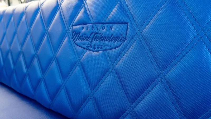 Slide: The Image of Blue quilted seat with Vision Marine Technologies logo, Volt 180, 2023 model. - 7