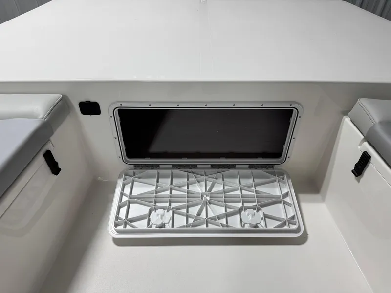 Slide: The Image of Open storage compartment on 2026 Bay Rider 2260 FS Skiff boat interior. - 10
