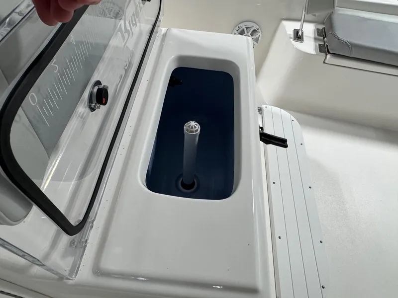 Slide: The Image of Livewell compartment on 2026 Bay Rider 2260 FS Skiff, featuring a clear lid and ruler markings. - 12