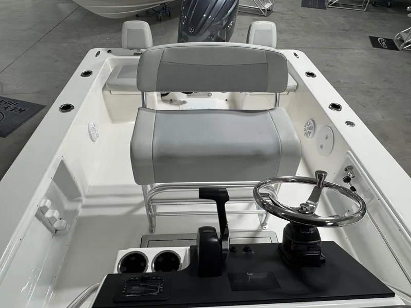 Slide: The Image of Bay Rider 2260 FS Skiff 2026 model, featuring a sleek console and seating in a showroom. - 13