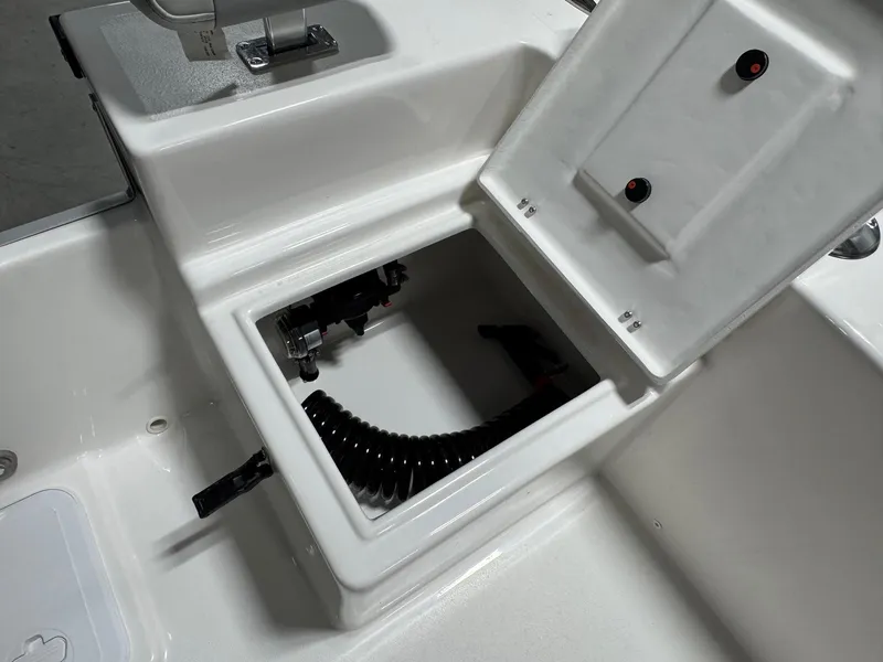 Slide: The Image of Open storage compartment on 2026 Bay Rider 2260 FS Skiff boat. - 19