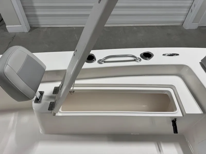Slide: The Image of 2026 Bay Rider 2260 FS Skiff boat seat and storage compartment detail. - 8