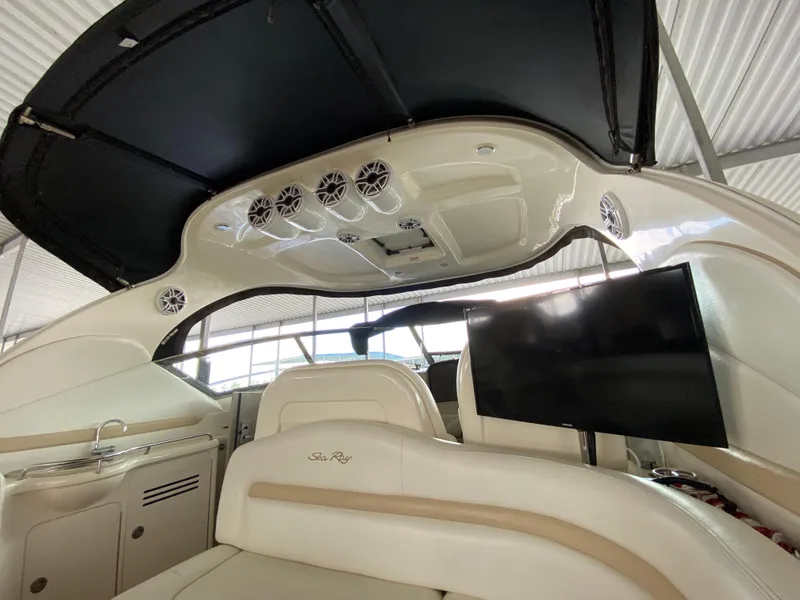 Slide: The Image of Interior of 2008 Sea Ray 38 Sundancer yacht with seating, TV, and speakers. - 14