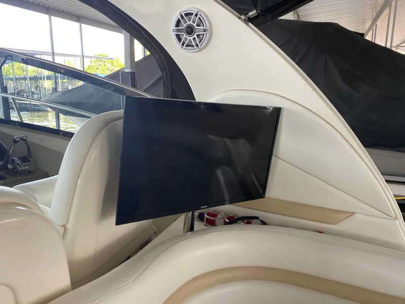 Slide: The Image of Interior of 2008 Sea Ray 38 Sundancer with mounted TV and speaker. - 15