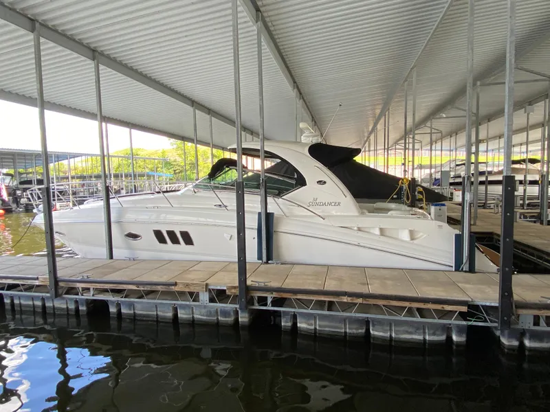 Slide: The Image of 2008 Sea Ray 38 Sundancer docked in a covered marina. - 3