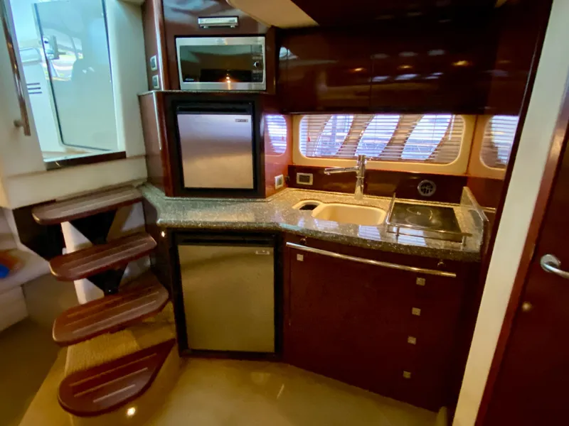 Slide: The Image of Luxurious 2008 Sea Ray 38 Sundancer yacht kitchen with modern appliances and sleek design. - 30