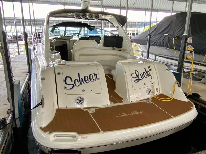 Slide: The Image of 2008 Sea Ray 38 Sundancer docked, featuring "Scheer Luck II" on the stern. - 4