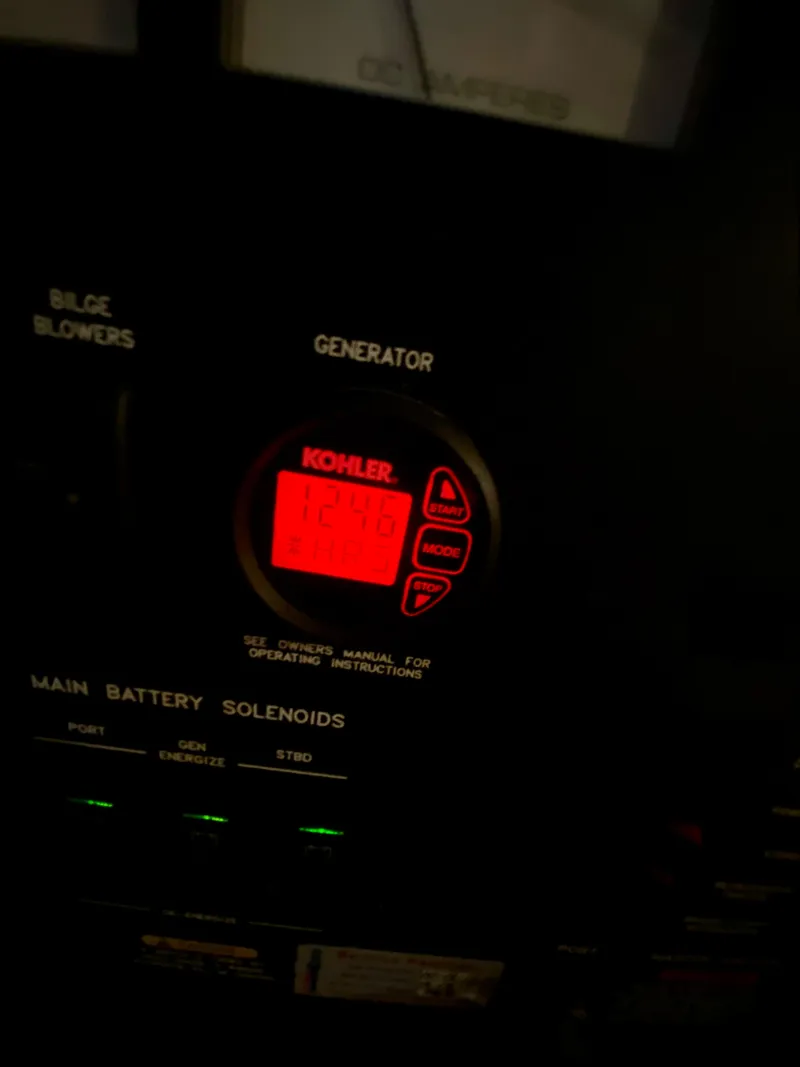 Slide: The Image of Control panel of a 2008 Sea Ray 38 Sundancer, featuring a Kohler generator display. - 44