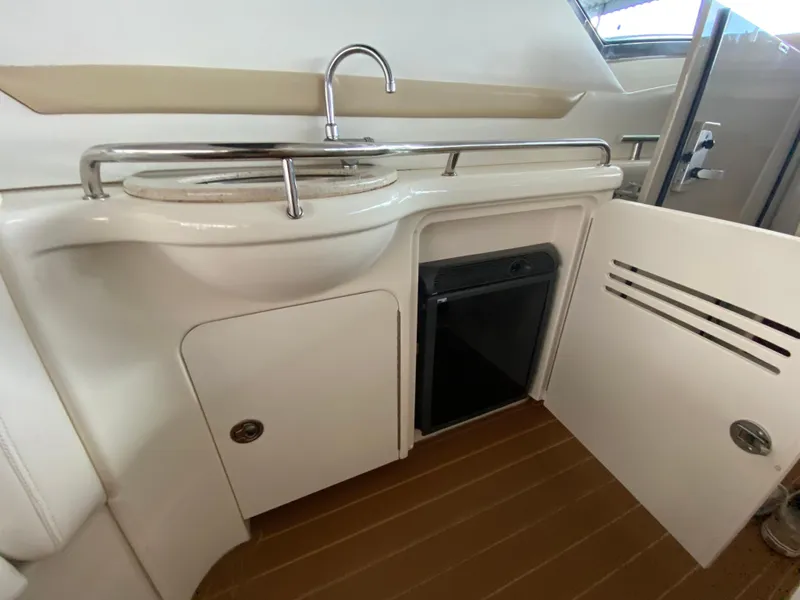 Slide: The Image of 2008 Sea Ray 38 Sundancer yacht interior with sink and storage cabinets. - 45
