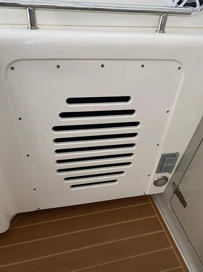 Slide: The Image of Vent panel on 2008 Sea Ray 38 Sundancer boat with teak flooring. - 46