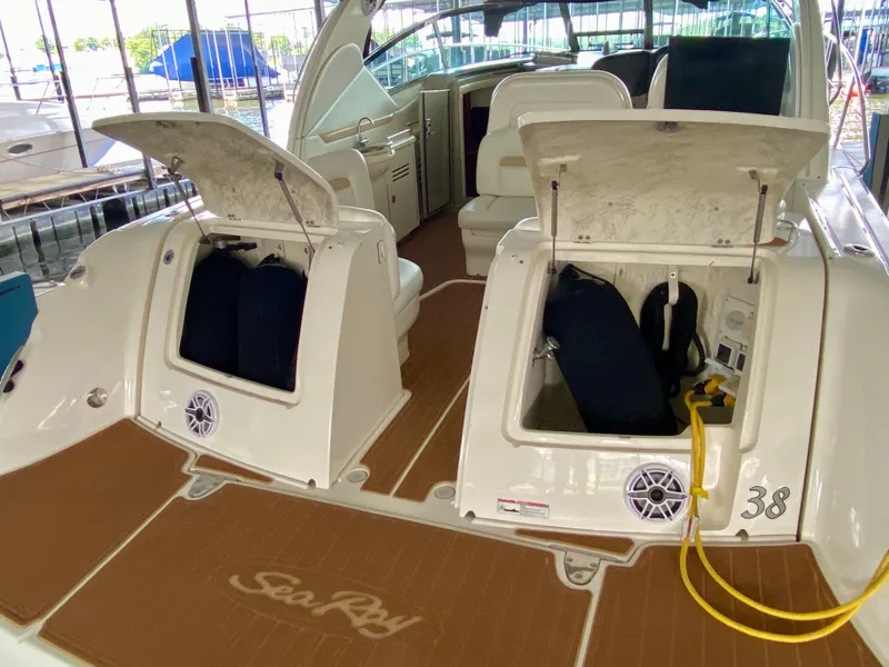 Slide: The Image of 2008 Sea Ray 38 Sundancer yacht with open storage compartments on deck. - 5