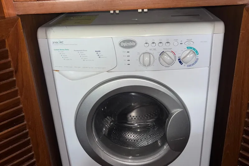 Slide: The Image of Splendide washer-dryer unit inside 1989 Jefferson 42 Sundeck Motor Yacht. - 21