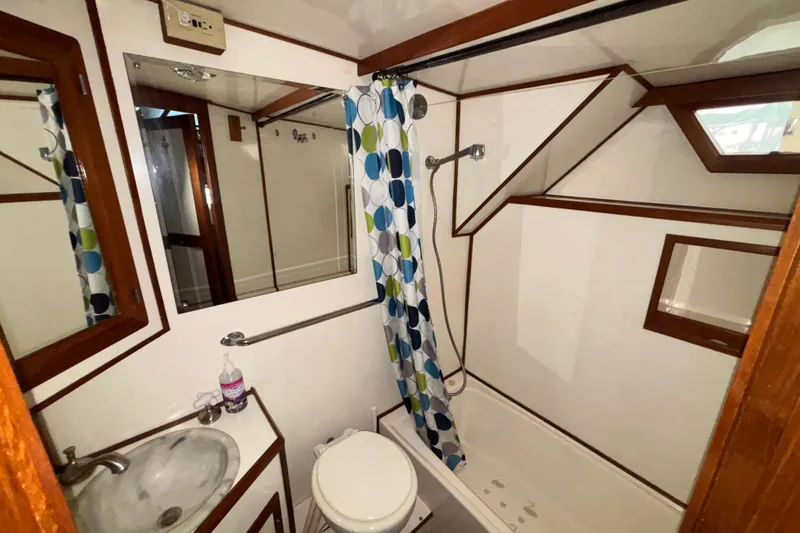 Slide: The Image of Bathroom interior of 1989 Jefferson 42 Sundeck Motor Yacht with shower and sink. - 18