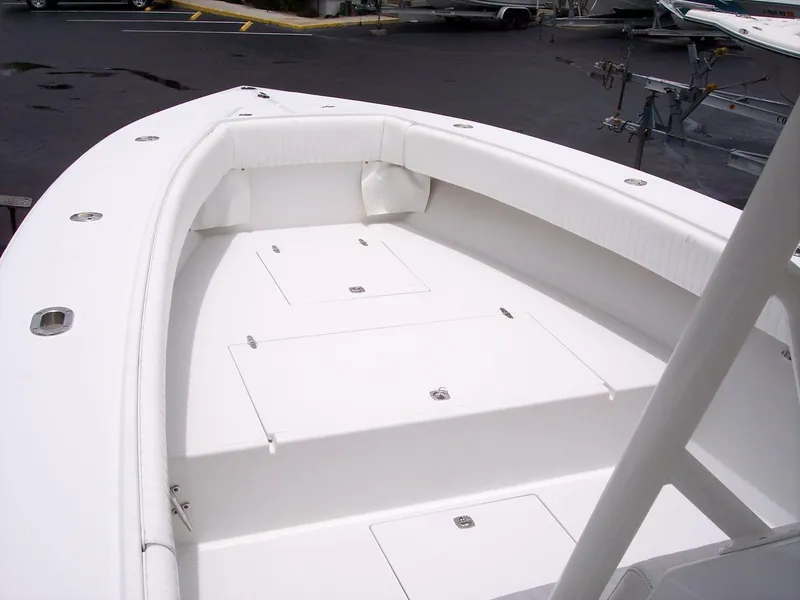 Slide: The Image of 2003 Jupiter 31 Center Console boat with spacious white deck and storage compartments. - 10
