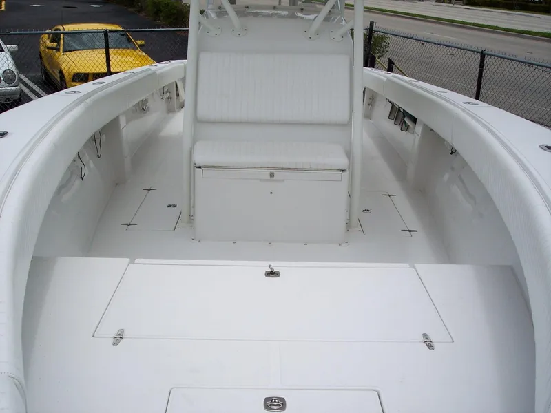 Slide: The Image of 2003 Jupiter 31 Center Console boat interior with seating and storage compartments. - 7