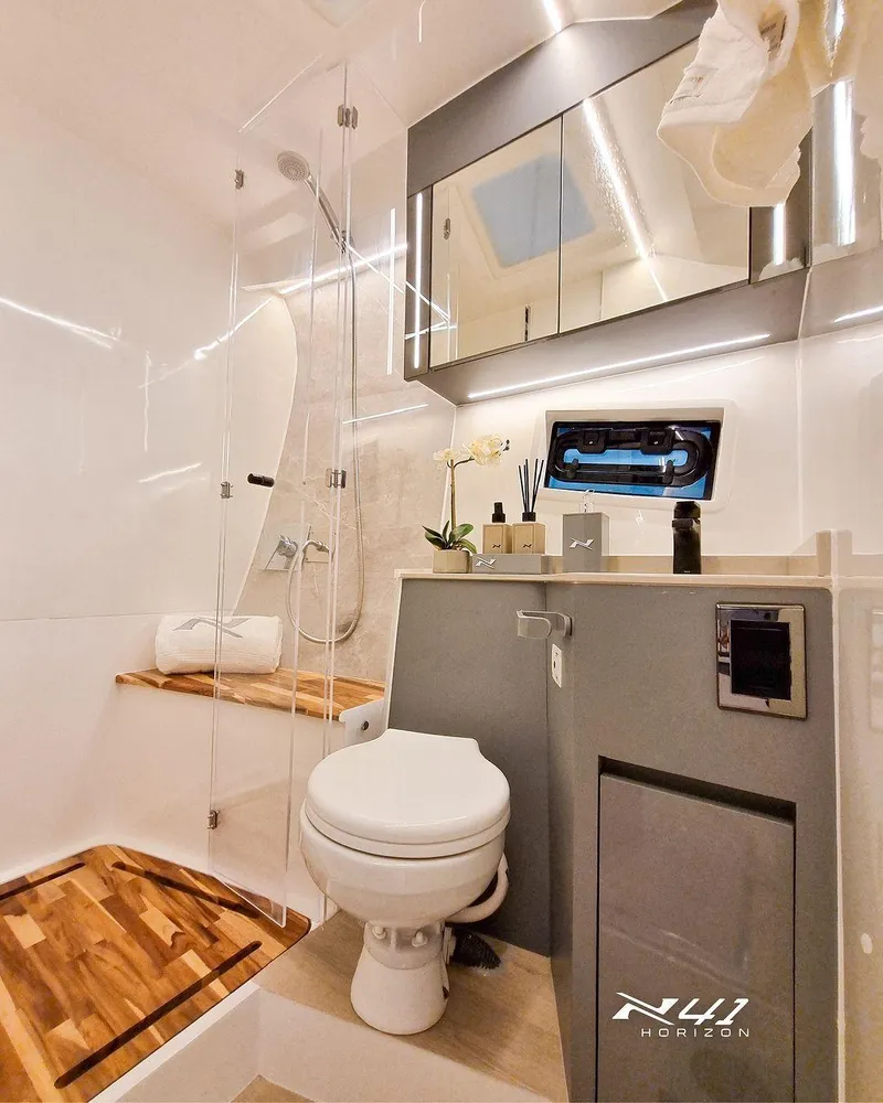 Slide: The Image of Luxurious bathroom in 2025 NX Boats NX41 HORIZON, featuring modern fixtures and elegant design. - 7