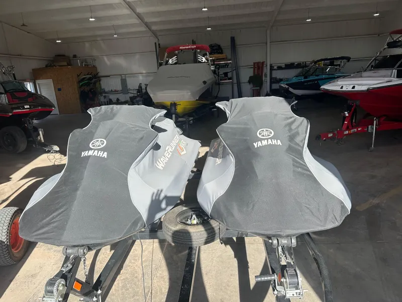 Slide: The Image of Two covered 2017 Yamaha WaveRunner VXR jet skis in a storage facility. - 10