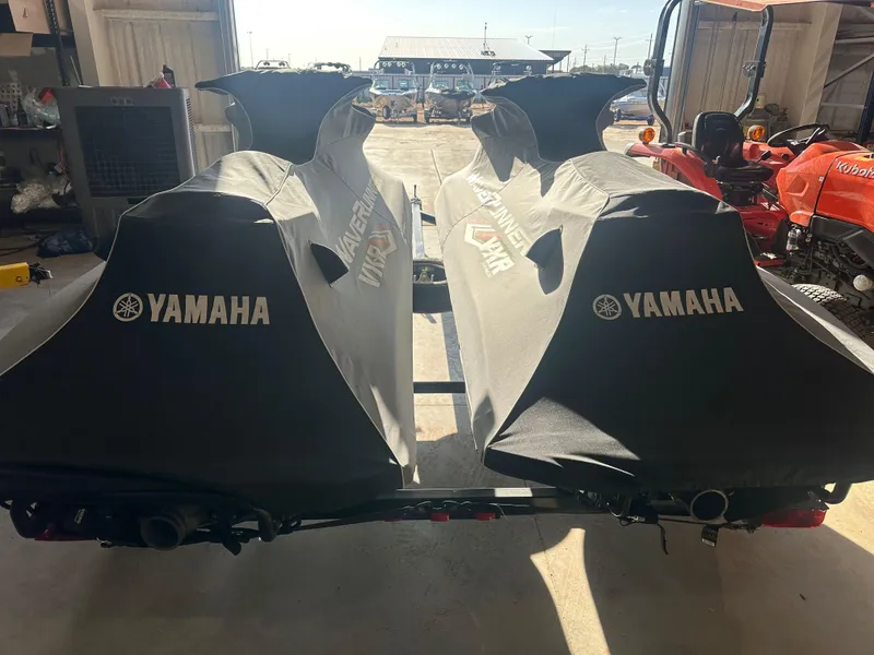 Slide: The Image of Two covered 2017 Yamaha WaveRunner VXR jet skis on a trailer in a garage. - 11