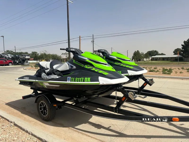 Slide: The Image of 2017 Yamaha WaveRunner VXR jet skis on a trailer, parked outdoors. - 3