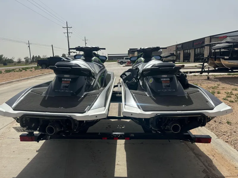 Slide: The Image of Two 2017 Yamaha WaveRunner VXR jet skis on a trailer in a parking lot. - 5