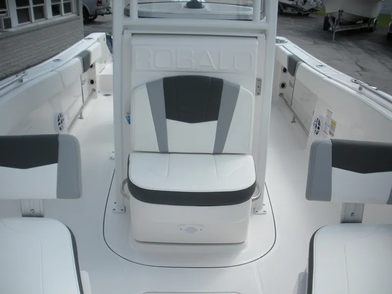 Slide: The Image of 2026 Robalo R230 Center Console boat interior with gray and white seating. - 10