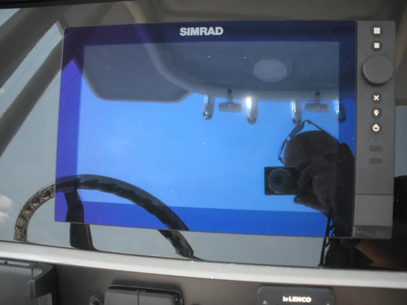 Slide: The Image of Simrad display on 2026 Robalo R230 Center Console boat dashboard. - 13
