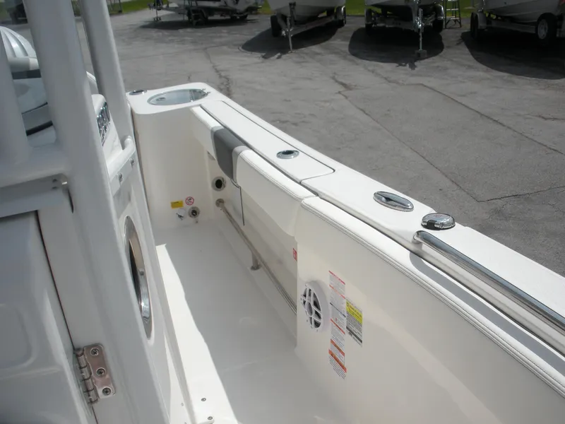 Slide: The Image of 2026 Robalo R230 Center Console boat interior with seating and storage features. - 16
