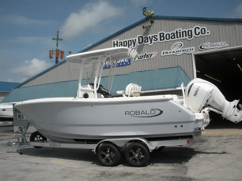 Slide: The Image of 2026 Robalo R230 Center Console boat on trailer at Happy Days Boating Co. - 2