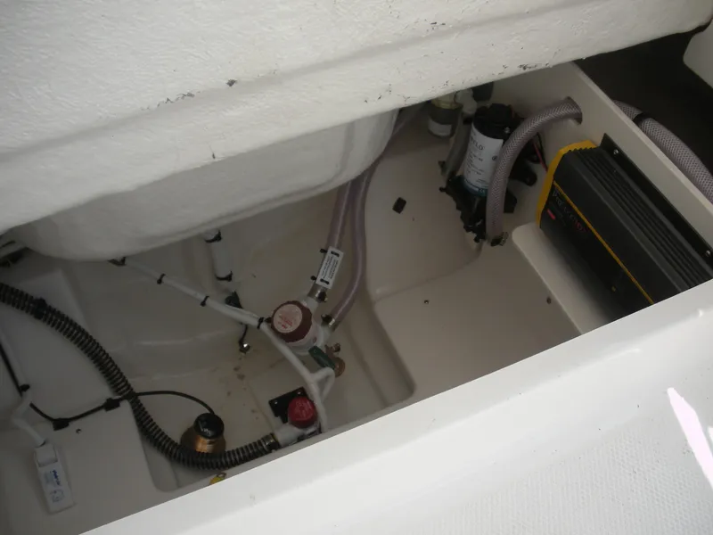 Slide: The Image of 2026 Robalo R230 Center Console boat interior wiring and equipment setup. - 23
