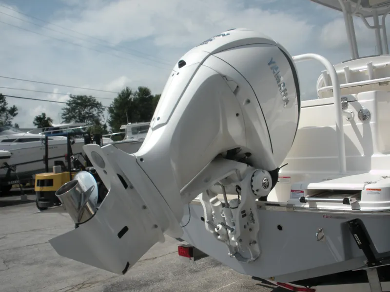 Slide: The Image of 2026 Robalo R230 Center Console with Yamaha outboard motor, displayed outdoors. - 25
