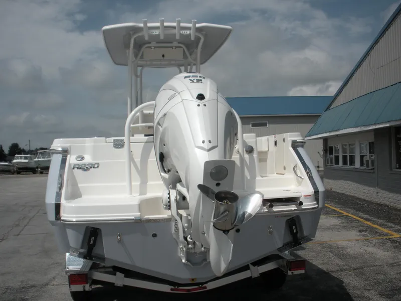 Slide: The Image of 2026 Robalo R230 Center Console boat with powerful outboard motor, parked outdoors. - 3