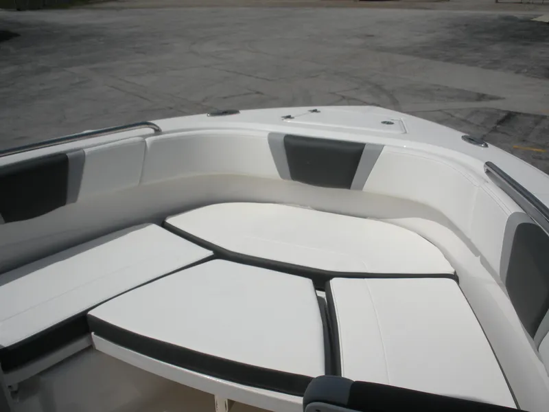 Slide: The Image of 2026 Robalo R230 Center Console boat interior with cushioned seating. - 5