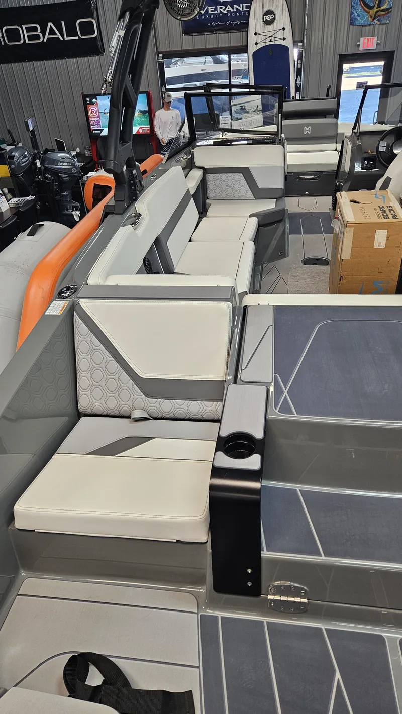 Slide: The Image of 2025 Heyday H22 boat interior with modern seating and sleek design. - 11