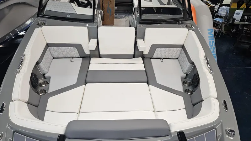 Slide: The Image of 2025 Heyday H22 boat interior with white and gray seating, cup holders, and modern design. - 13