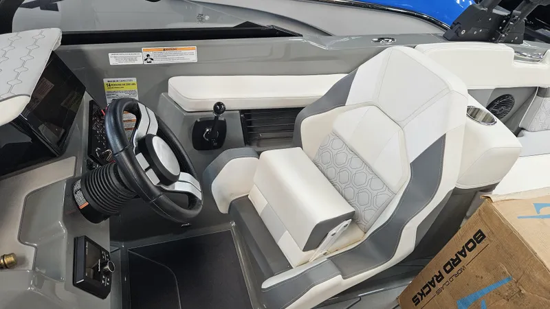 Slide: The Image of 2025 Heyday H22 boat cockpit with modern steering wheel and comfortable seating. - 15