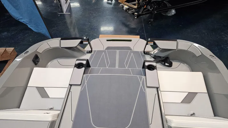 Slide: The Image of 2025 Heyday H22 boat interior with sleek seating and cup holders. - 16
