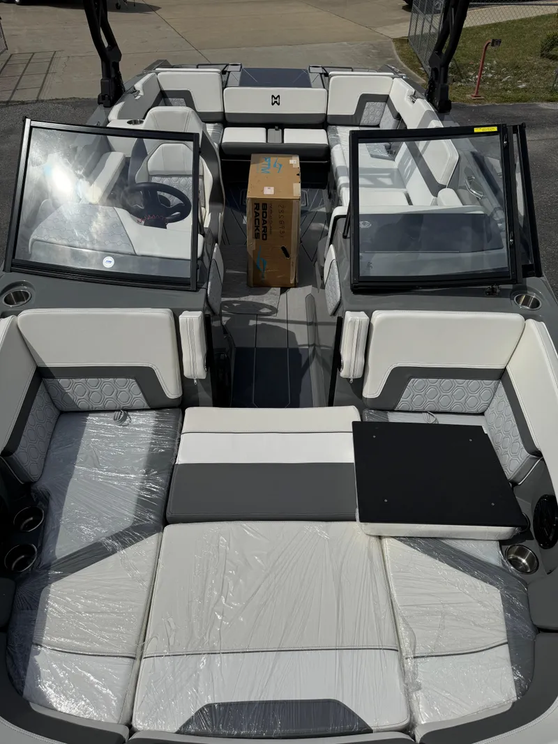 Slide: The Image of 2025 Heyday H22 boat interior with modern seating and windshield, featuring a central package. - 8