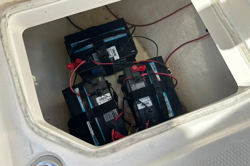 Slide: The Image of Batteries in a 2021 Robalo R230 Center Console boat compartment. - 11