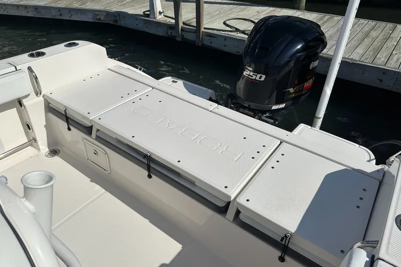 Slide: The Image of 2021 Robalo R230 Center Console boat with Yamaha 250 engine at dock. - 24