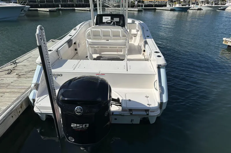 Slide: The Image of 2021 Robalo R230 Center Console boat docked with Yamaha 250 engine. - 4