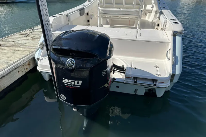 Slide: The Image of 2021 Robalo R230 Center Console boat with Yamaha 250 outboard motor at dock. - 5