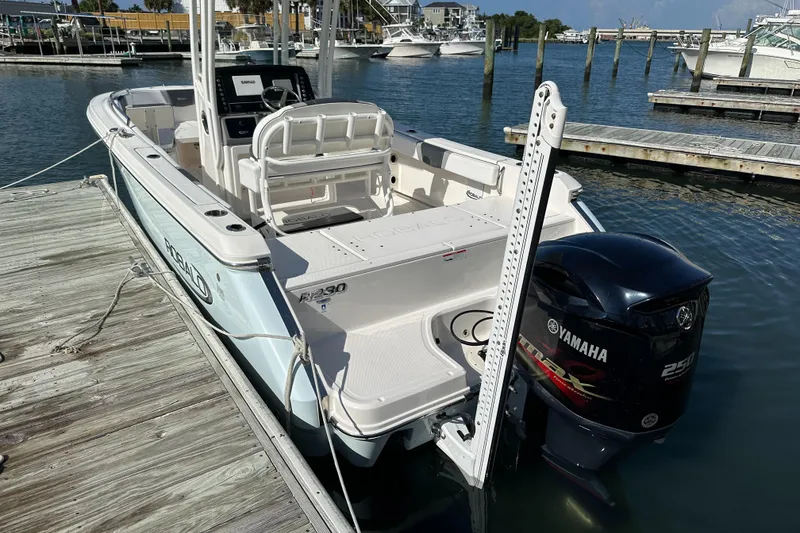 Slide: The Image of 2021 Robalo R230 Center Console boat docked with Yamaha 250 engine. - 6