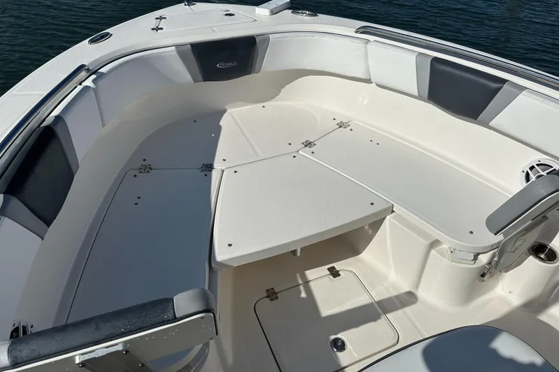 Slide: The Image of 2021 Robalo R230 Center Console boat interior with seating and storage compartments. - 9