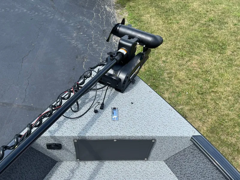 Slide: The Image of 2026 Lund 1775 Adventure SS boat with trolling motor on a grassy area. - 13