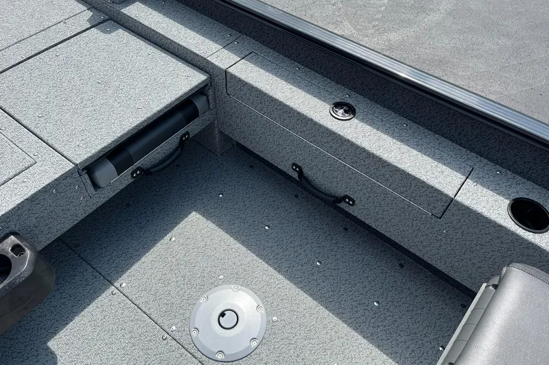 Slide: The Image of Interior of 2026 Lund 1775 Adventure SS boat, featuring storage compartments and cup holders. - 20