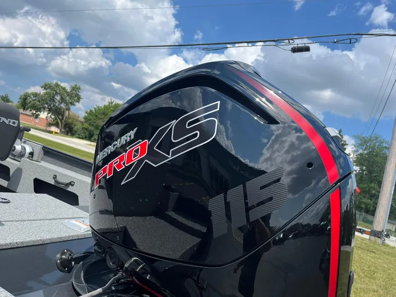 Slide: The Image of 2026 Lund 1775 Adventure SS with Mercury Pro XS 115 engine under a blue sky. - 25