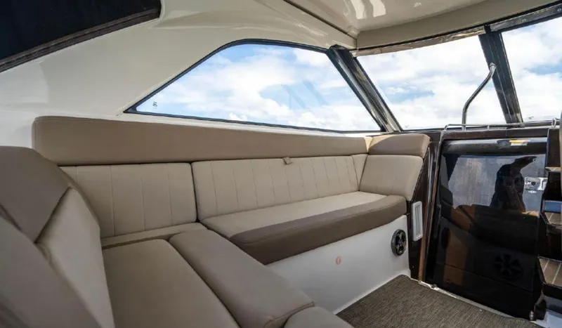 Slide: The Image of Interior of 2015 Regal 35 Sport Coupe with beige seating and large windows. - 5