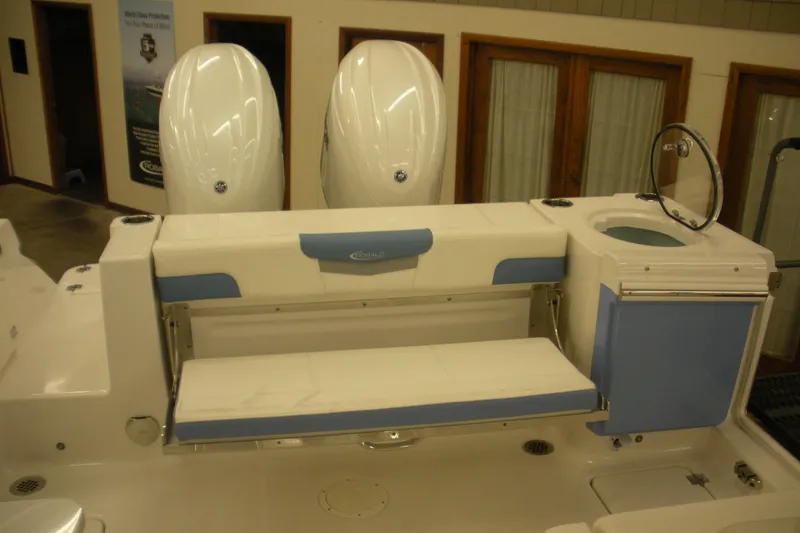 Slide: The Image of 2026 Robalo R257 Dual Console boat interior with seating and storage features. - 17